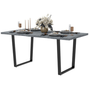 Industrial dining table with wavy edge top and steel legs, seats up to 6, cement gray