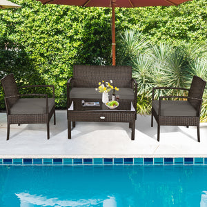 Set of 4 upholstered rattan patio furniture pieces - brown