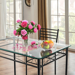 5-piece dining table with glass top and 4 upholstered chairs