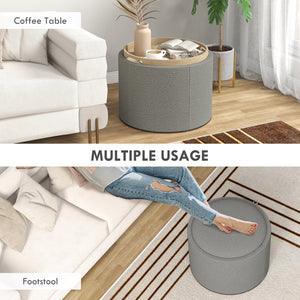 Round coffee table with hidden storage and gray linen upholstered top