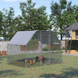 Galvanized metal chicken coop with flat roof and tarp