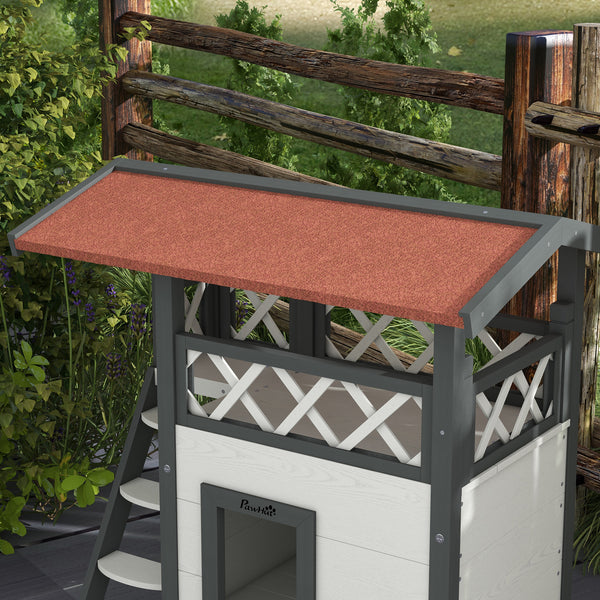 Two-story cat house with asphalt roof, stairs, and balcony