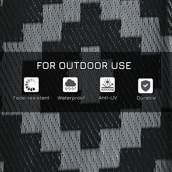 Reversible waterproof outdoor rug made of plastic straw, black and grey geometric pattern