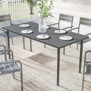 Outdoor dining table for 6 people, made of metal with a slatted top.