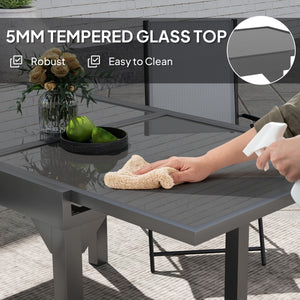 Extendable outdoor table with tempered glass top and metal frame