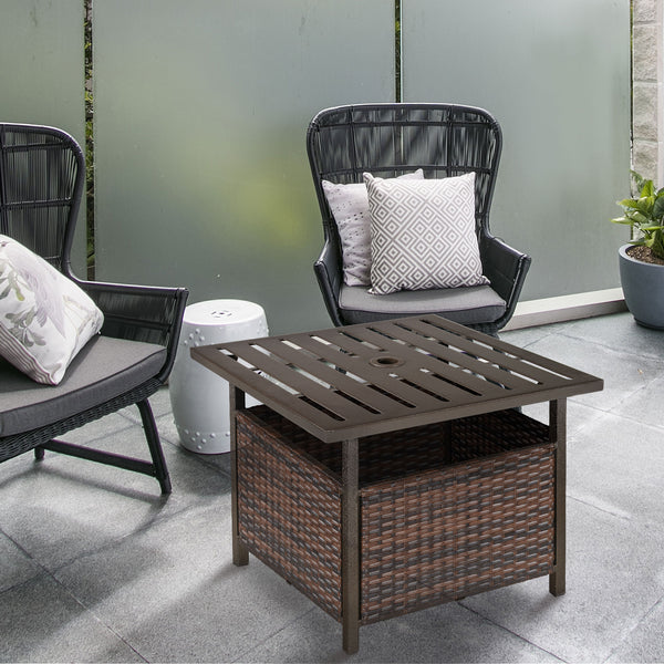 Outdoor patio coffee table in woven rattan with parasol hole, brown