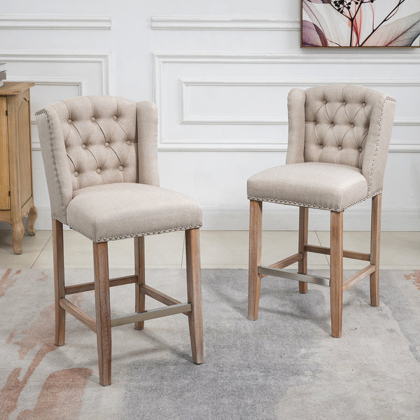 Set of 2 padded bar stools with studded backrest and footrest, beige
