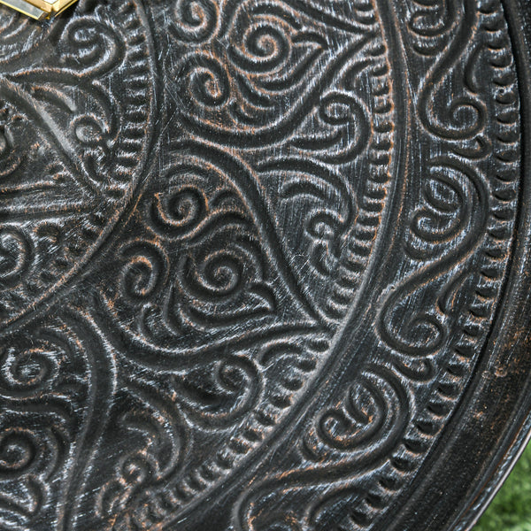 Vintage round coffee table with hammered top and metal frame, pewter color