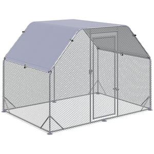Galvanized metal chicken coop with flat roof and tarp