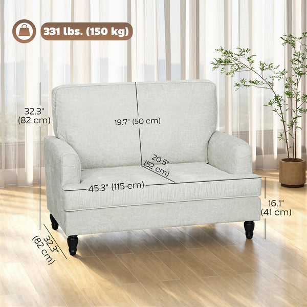 Modern faux leather accent chair with turned legs and wide seat, cream white