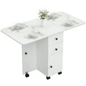Dining table with drop leaves on castors with drawers and cupboard, marbled white