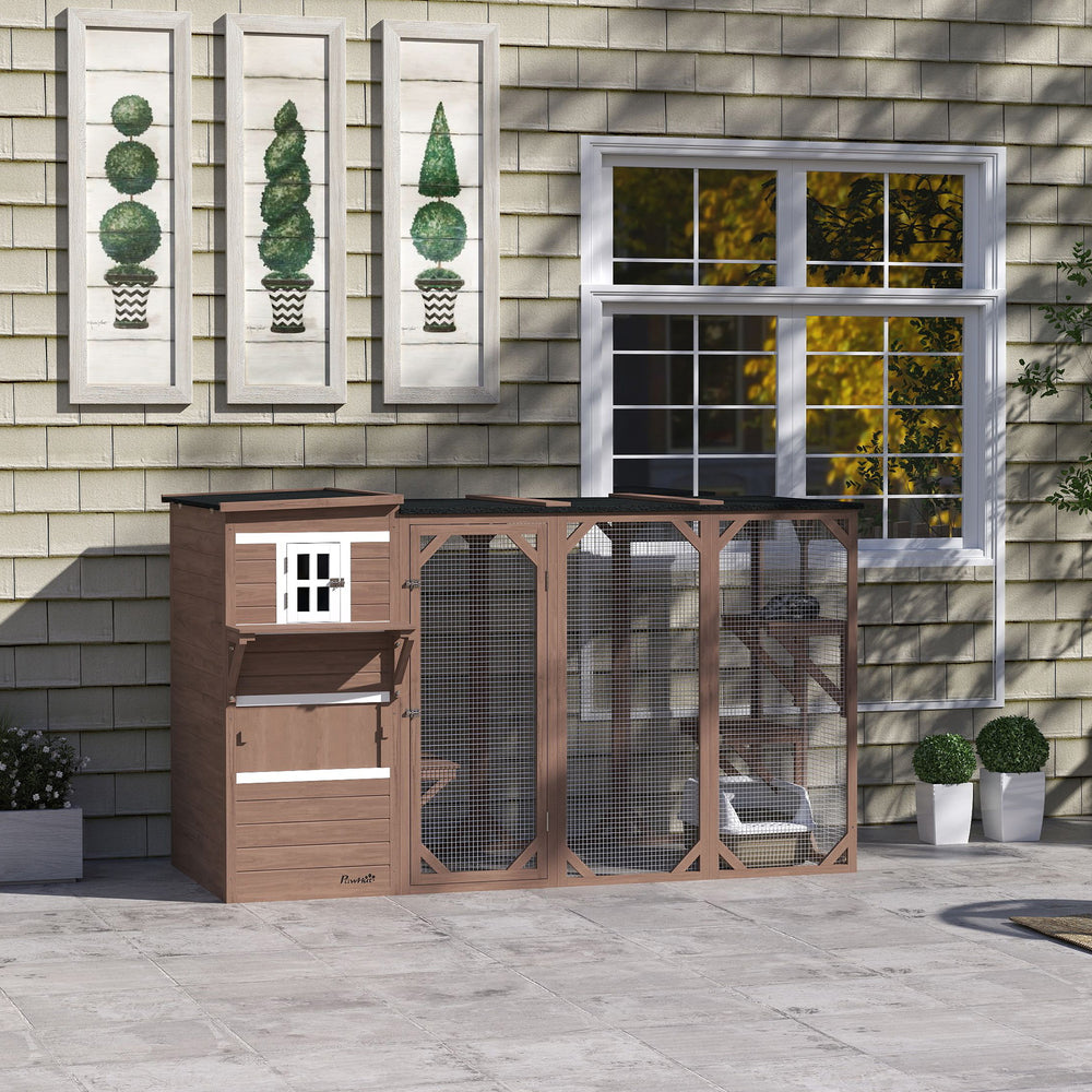 Wooden cat enclosure with asphalt roof, platforms and lockable doors, brown.