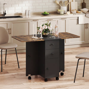 Drop-leaf dining table on casters with drawers and cupboard, rustic brown and black.
