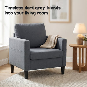 Modern upholstered armchair with thick, padded seat and armrests, dark grey 