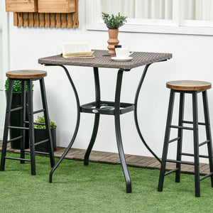 Outdoor coffee table in woven resin with a hole for a parasol, light grey