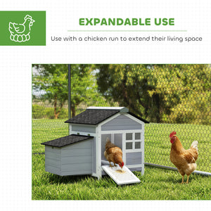 Wooden chicken coop with nesting box and removable metal tray