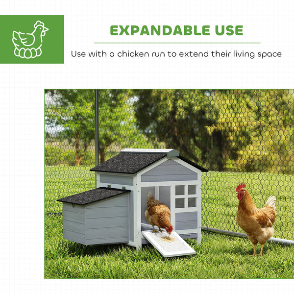 Wooden chicken coop with nesting box and removable metal tray