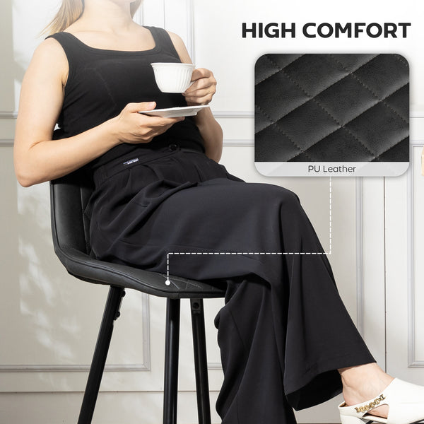 Set of 2 black faux leather bar stools.