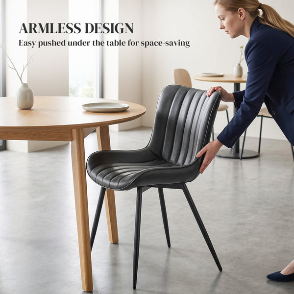 Set of 2 upholstered faux leather dining chairs with backrest and steel legs, black