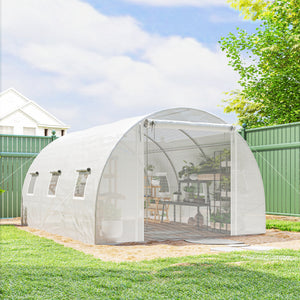 White heated tunnel greenhouse for plants with support bars