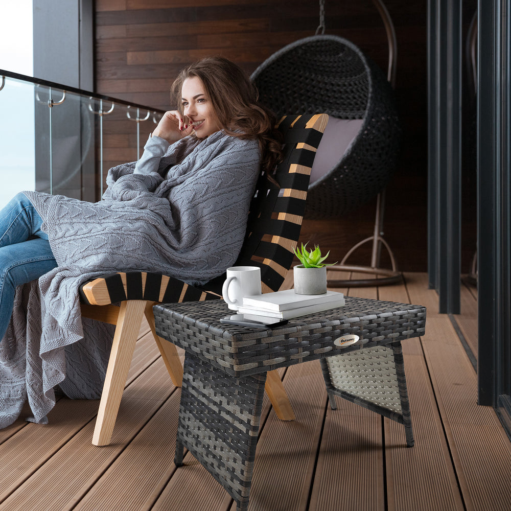 Folding outdoor side table in woven rattan