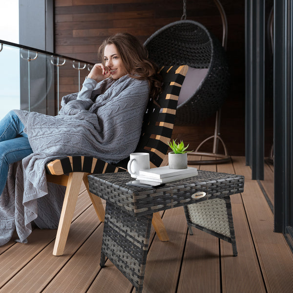 Folding outdoor side table in woven rattan