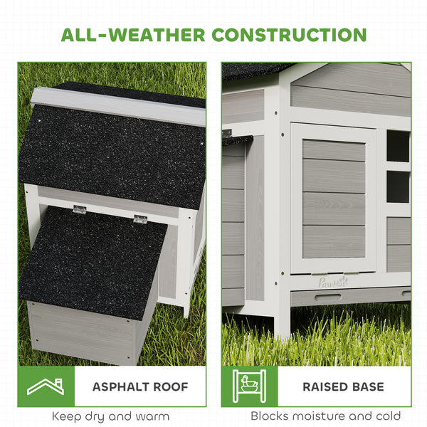 Wooden chicken coop with nesting box and removable metal tray