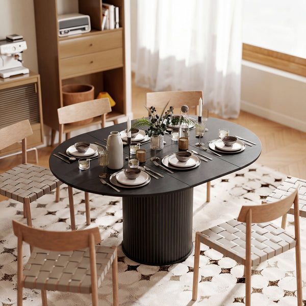 Extendable kitchen table for 6 to 8 people, farmhouse style, with a pedestal base and black wood finish.