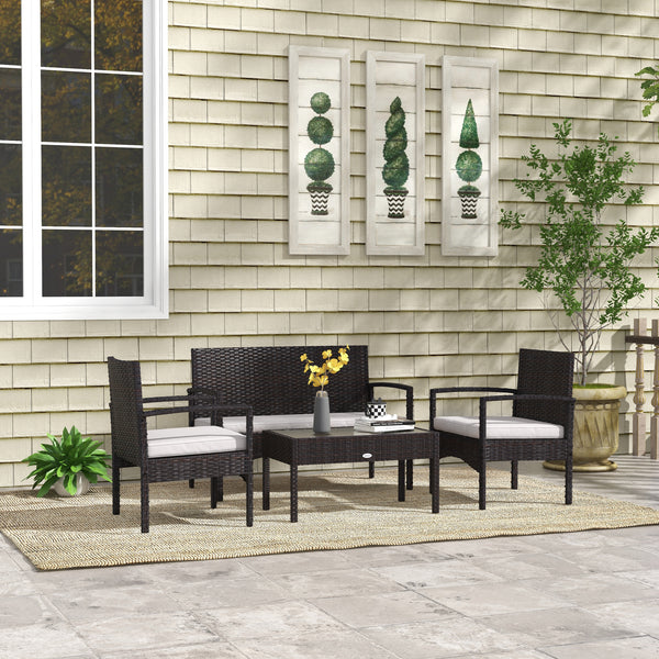 Ensemble de jardin 4 pièces blanc comprenant canapé causeuse, deux fauteuils et une table basse, idéal pour terrasse ou espace extérieur lumineux.