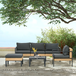 Ensemble de jardin 6 pièces en osier tressé comprenant canapé, fauteuil, tabouret, table basse et coussins, idéal pour aménagement extérieur