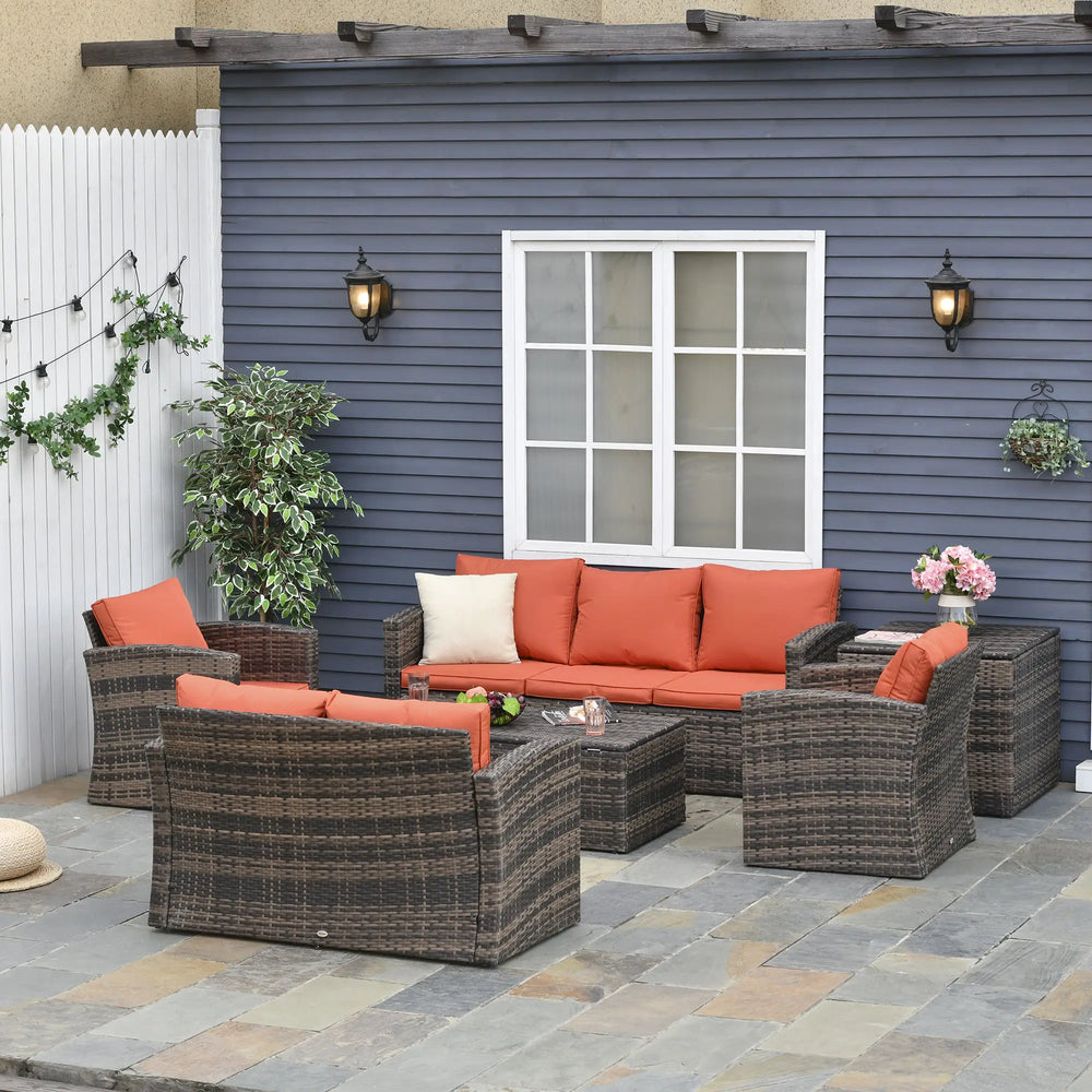 Ensemble de jardin en osier tressé comprenant 6 pièces avec coussins orange vif et table de rangement intégrée, parfait pour espace extérieur moderne.

