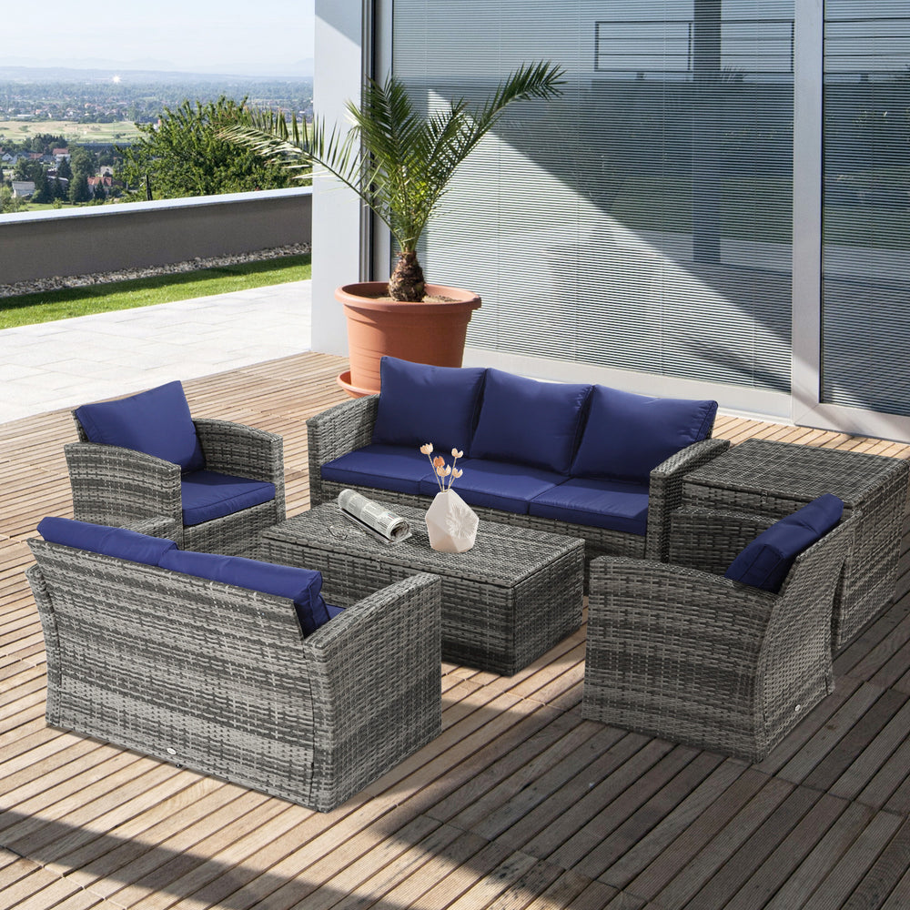 Ensemble de jardin 6 pièces en rotin tressé avec coussins bleu marine, canapé d’angle 7 places et table de rangement, idéal pour terrasse ou patio spacieux.