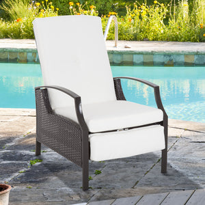 Outdoor reclining rattan chair with white cushion