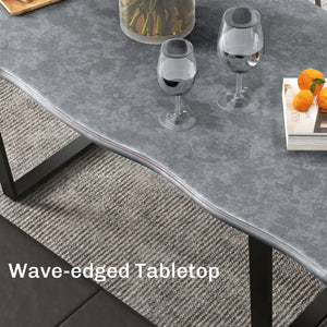 Industrial dining table with wavy edge top and steel legs, seats up to 6, cement gray