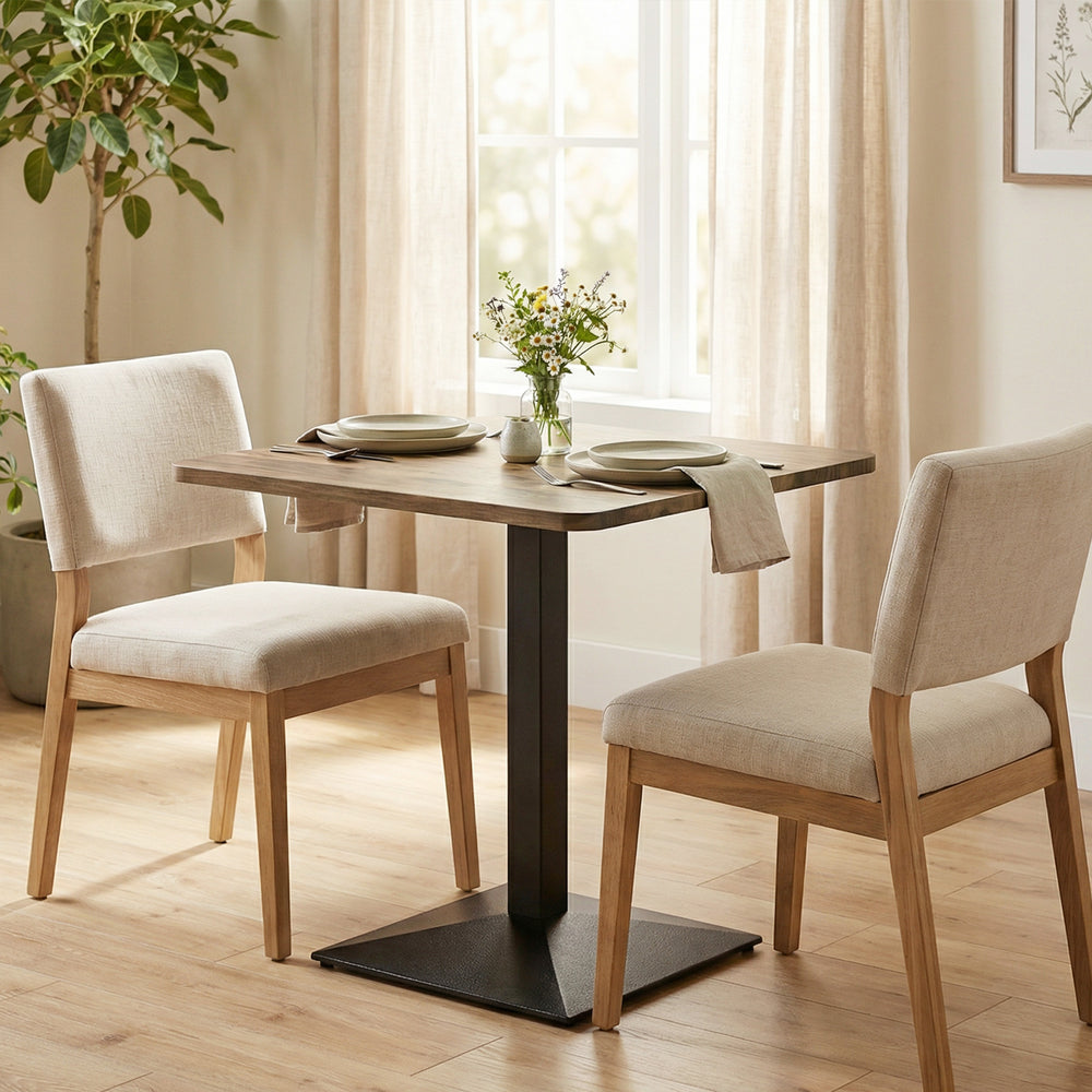Square dining table with steel base, compact and space-saving, walnut-look.