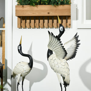 Set of 2 heron statues, white and black