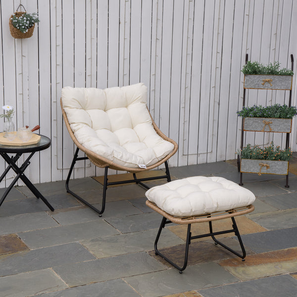 Rattan armchair with footrest