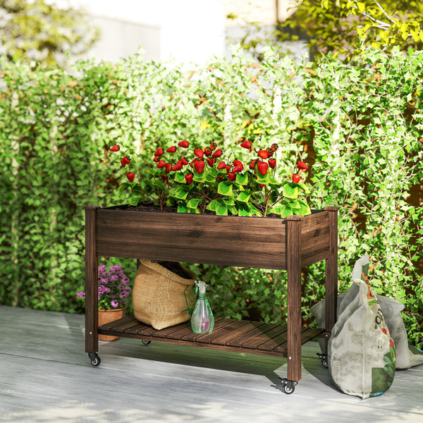 Raised wooden planter with lockable casters and storage shelf