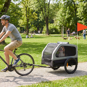 Dog bike trailer, suitable for small to medium-sized dogs up to 20 kg, with universal hitch and fold-down ramp tailgate, grey.