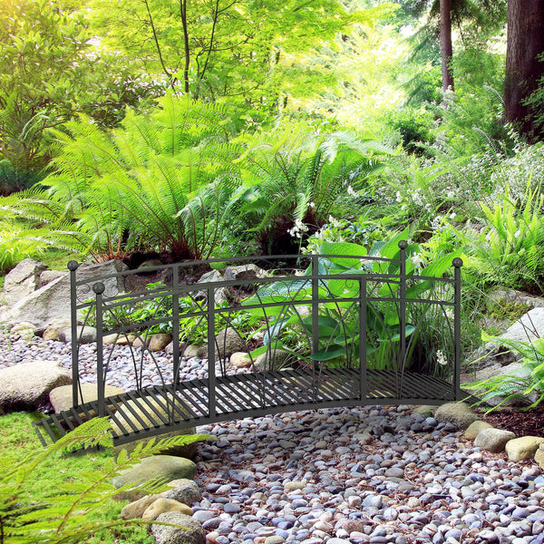 Metal garden walkway with railing and decorative scrolls, black