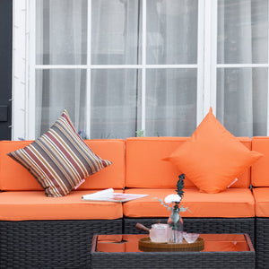 Modular 7-piece garden set in woven resin with coffee table, orange