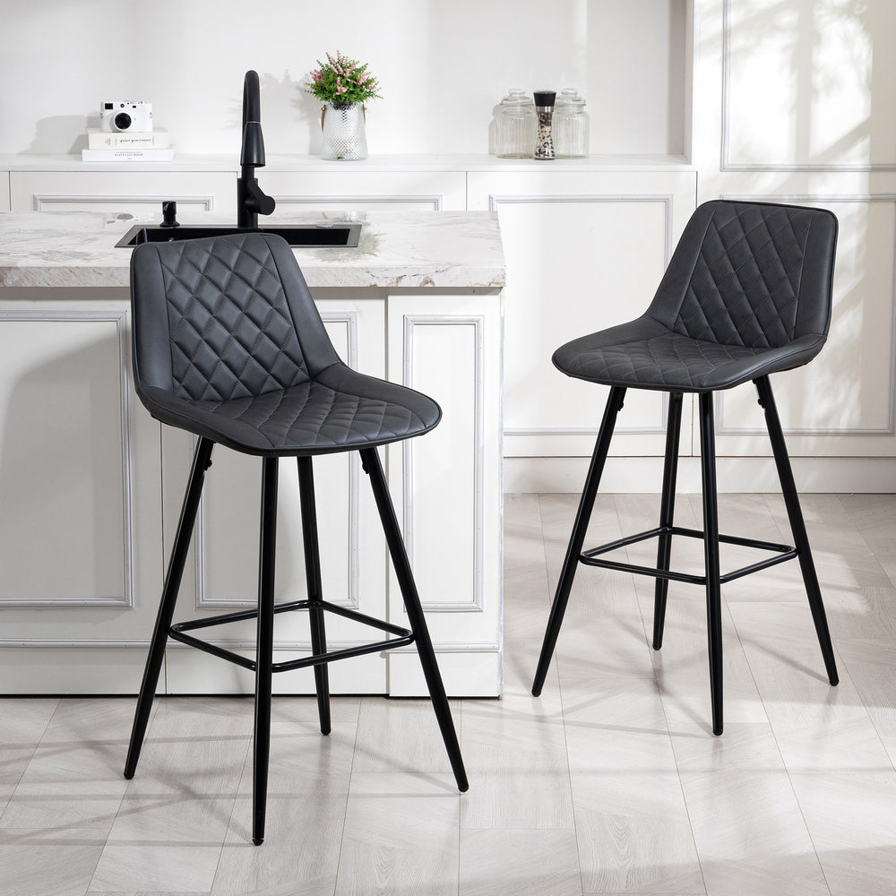Set of 2 black faux leather bar stools.