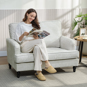 Modern faux leather accent chair with turned legs and wide seat, cream white