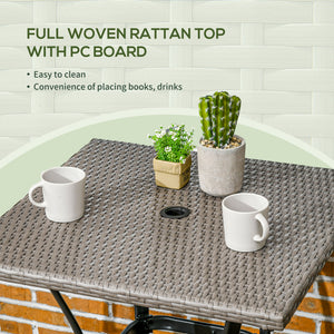 Outdoor coffee table in woven resin with a hole for a parasol, light grey