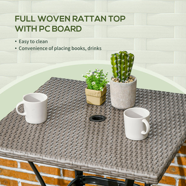 Outdoor coffee table in woven resin with a hole for a parasol, light grey