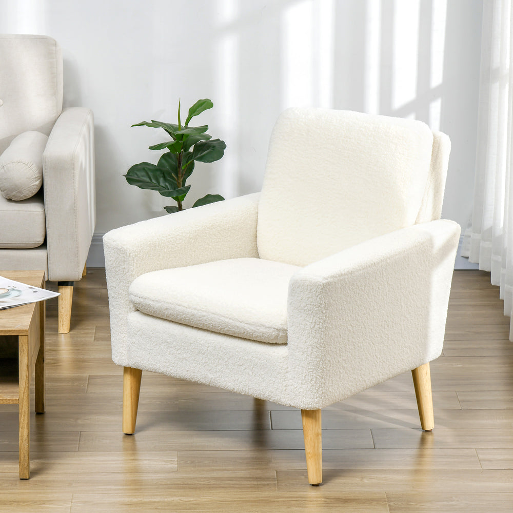 Modern upholstered armchair with wooden legs and wide padded seat, cream white