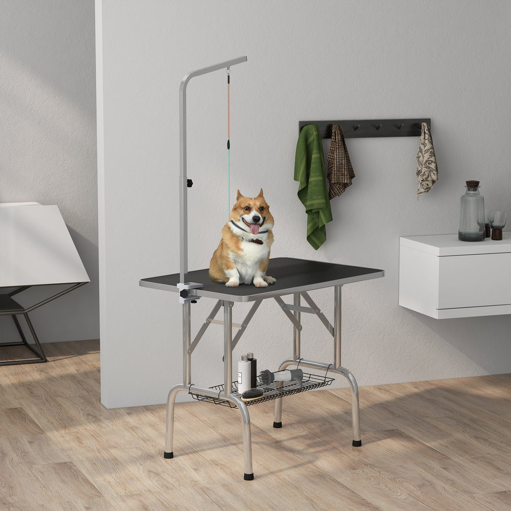 Foldable grooming table with height-adjustable grooming arm and storage shelf, black
