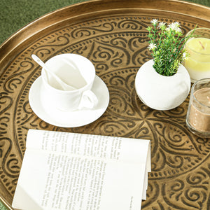 Vintage round coffee table with hammered top and metal frame, gold