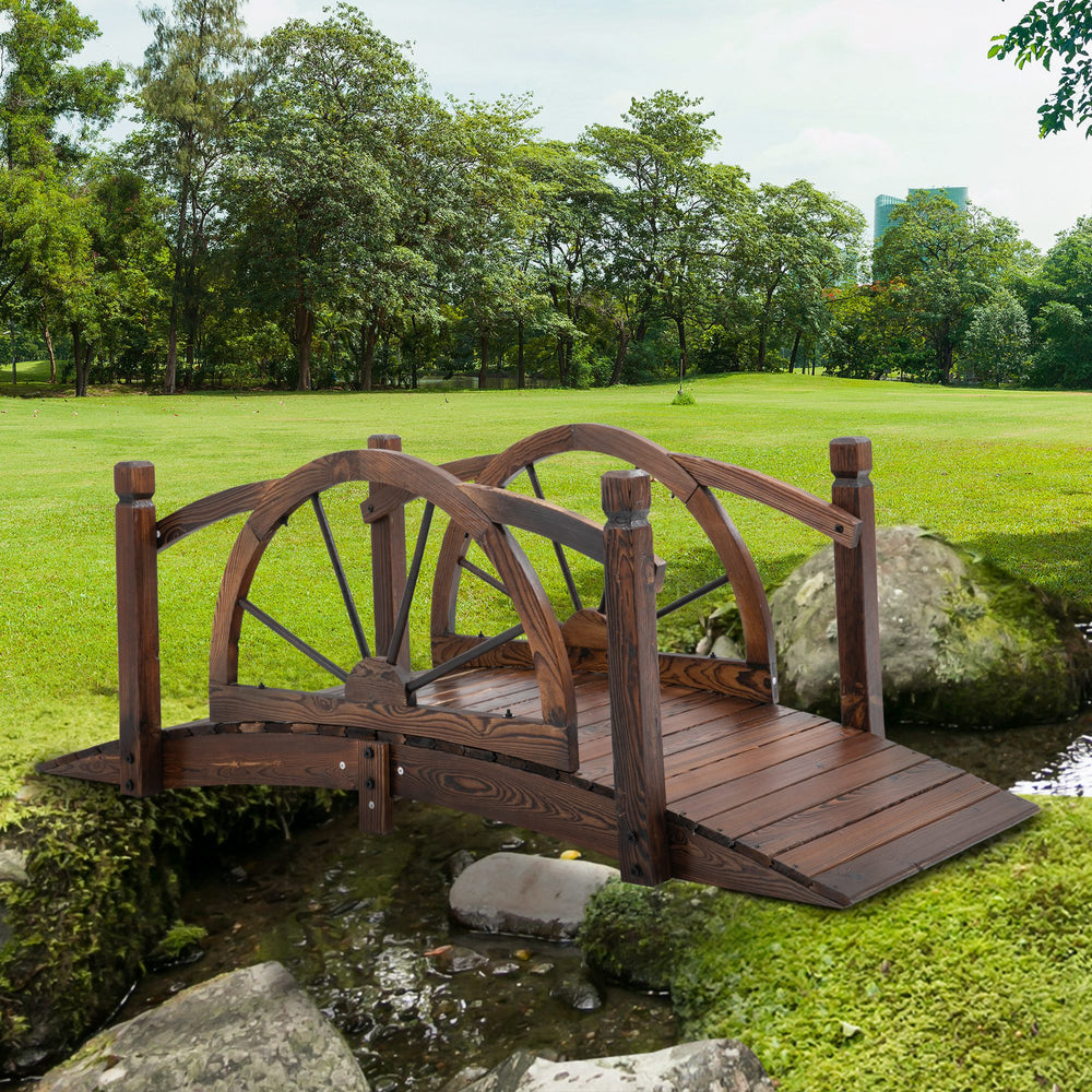 Wooden garden bridge, decorative arched walkway with safety railing 