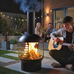 Wood-burning outdoor fireplace with poker, charcoal grate, modern design chimney, black